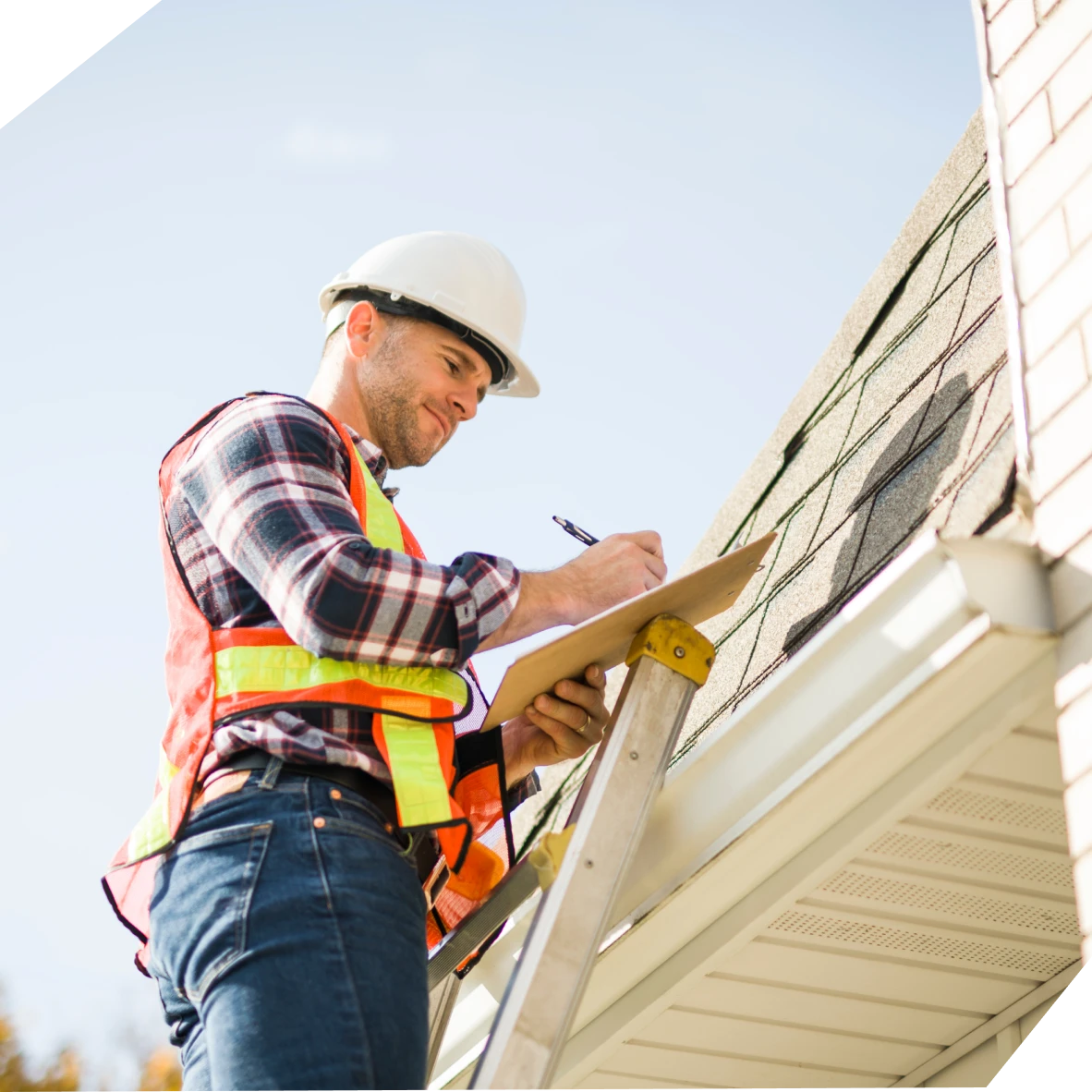 Man assessing roof with clipboard